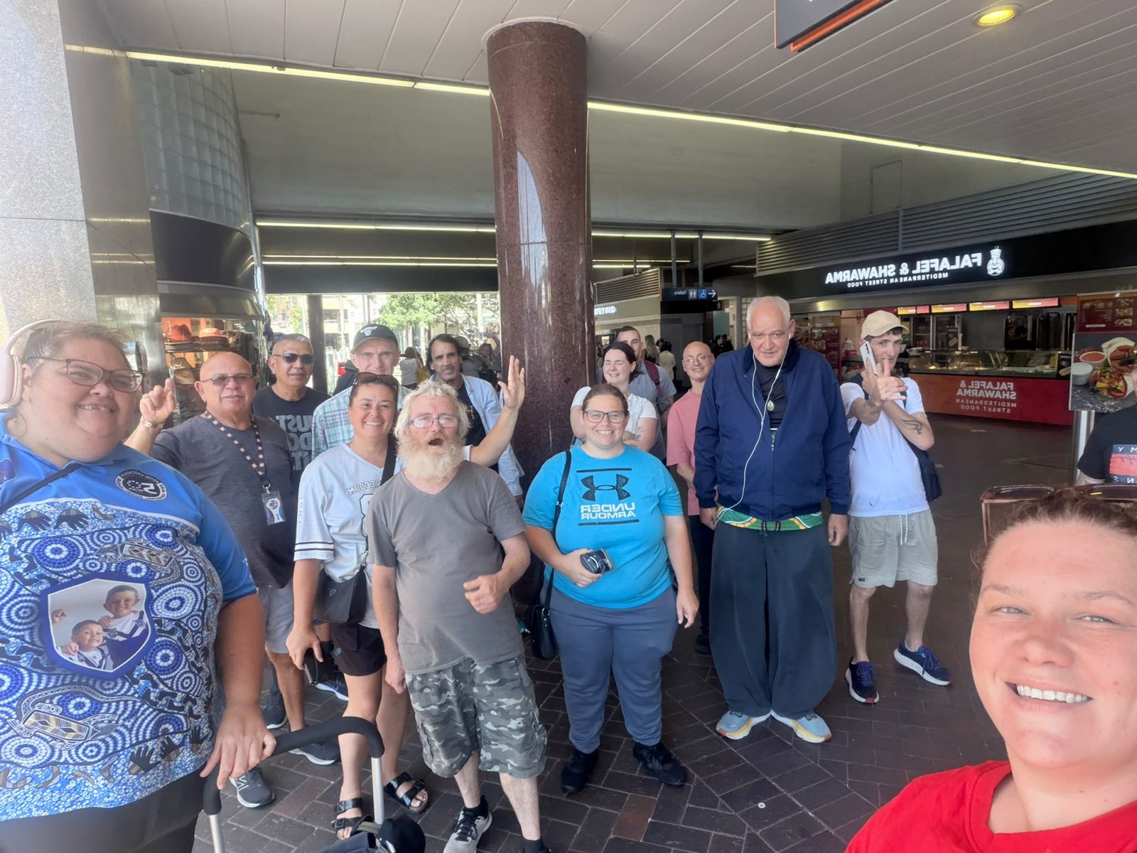 Tegrity support workers and participants together at a Sydney ferry terminal on a community outing