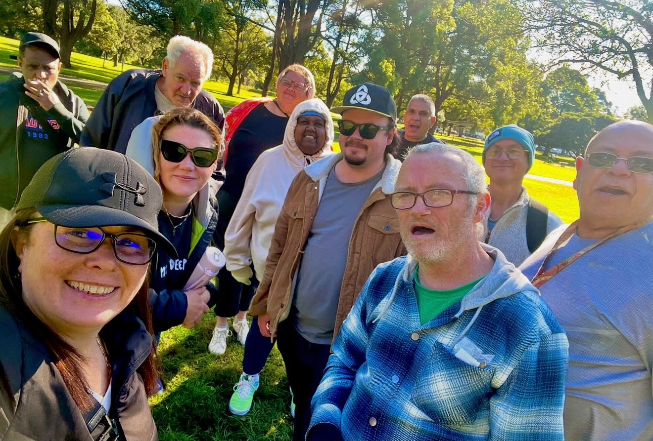 The Tegrity Wednesday rec group, women and men together for a selfie in a sunny Sydney park