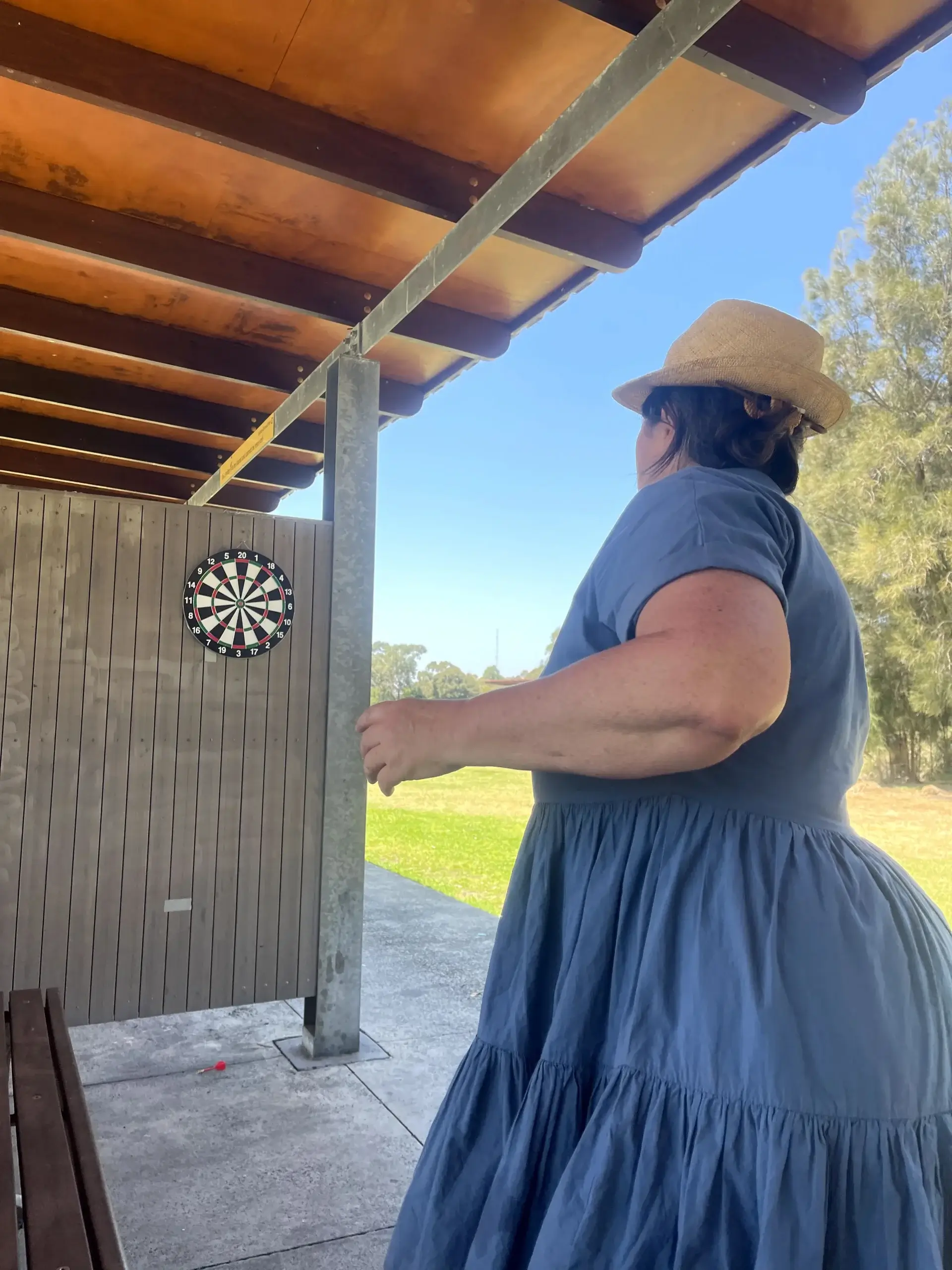 NDIS Community Participation - client playing dart with community activity